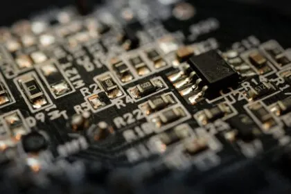 Close-up of a microchip on electronic circuit board representing AI semiconductor manufacturing
