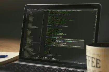 GitHub Copilot plan changes — developer coding on laptop | Photo by Daniil Komov on Pexels