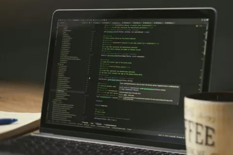 GitHub Copilot plan changes — developer coding on laptop | Photo by Daniil Komov on Pexels