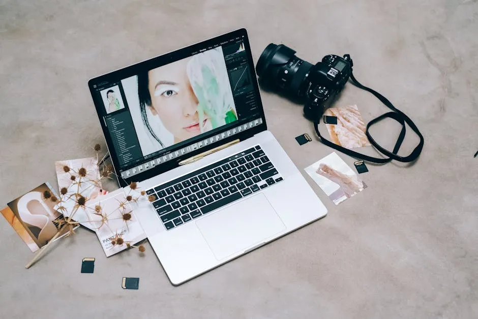 A creative workspace featuring photography equipment and a laptop for digital editing and photo management. — Photo by Leeloo The First on Pexels