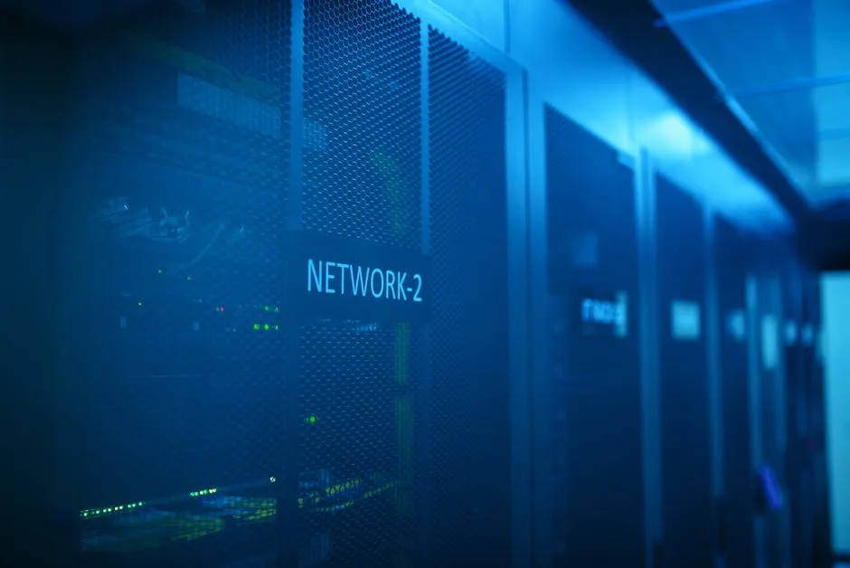 A modern server room featuring network equipment with blue illumination. Ideal for technology themes. — Photo by panumas nikhomkhai on Pexels