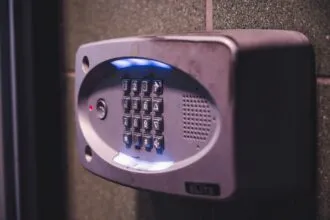 Illuminated security keypad on a wall representing password protection
